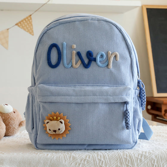 Powder blue backpack with a knitted name