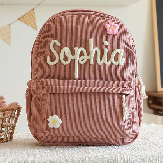 Dusty rose backpack with a knitted name